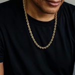 man wearing a gold necklace