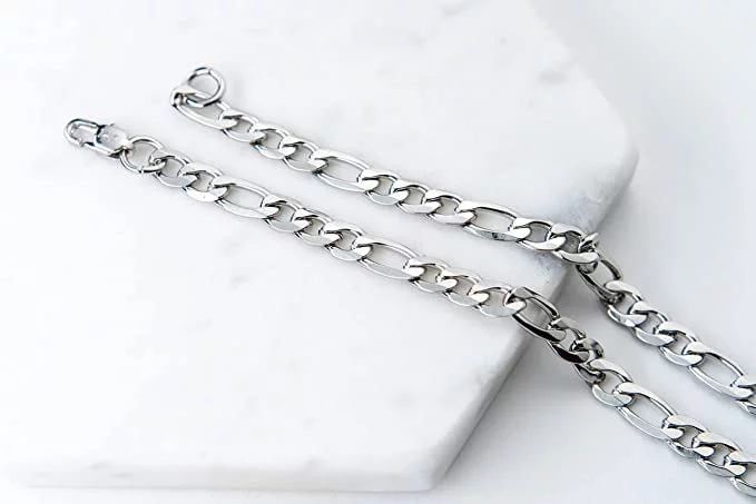 Silver chain for men on a white surface